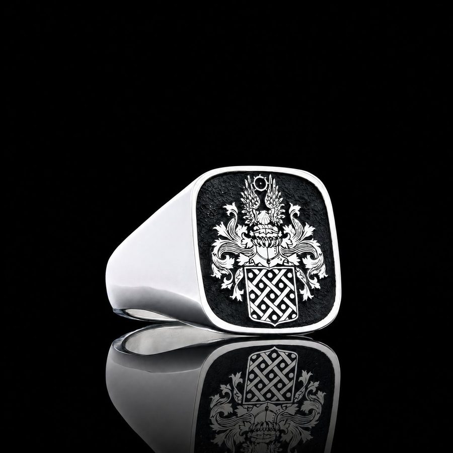 Silver cushion-shaped signet ring engraved with a full coat of arms on a blackened face